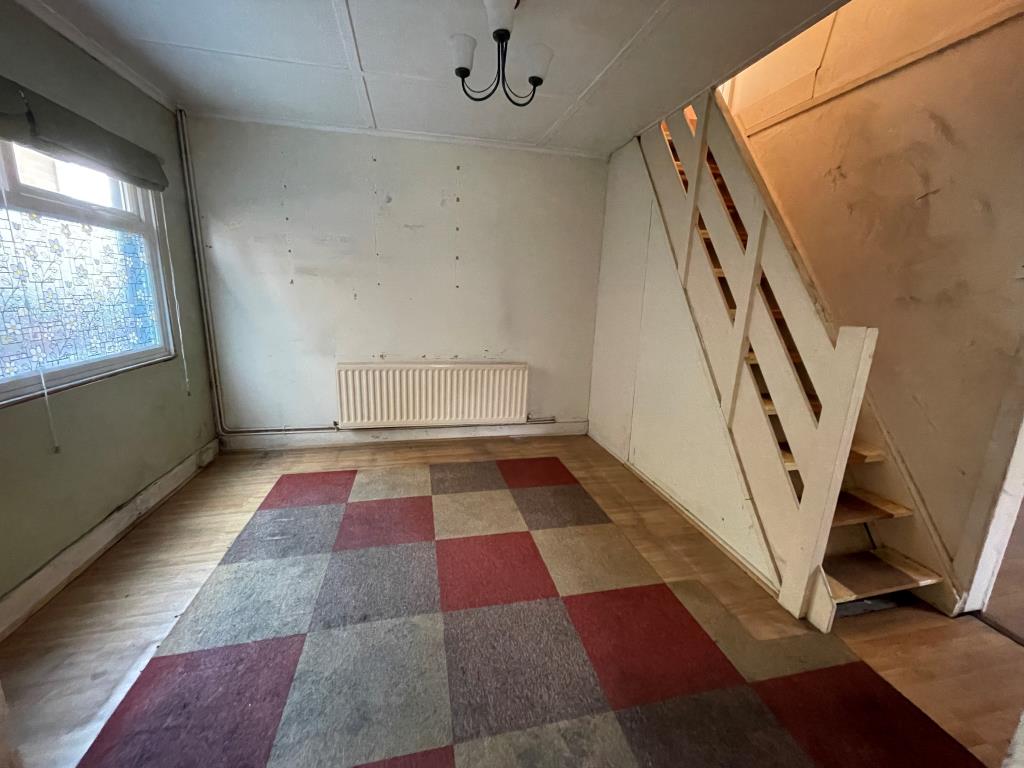 Lot: 88 - FIRE-DAMAGED DETACHED BUNGALOW - Room with stairs up to first floor